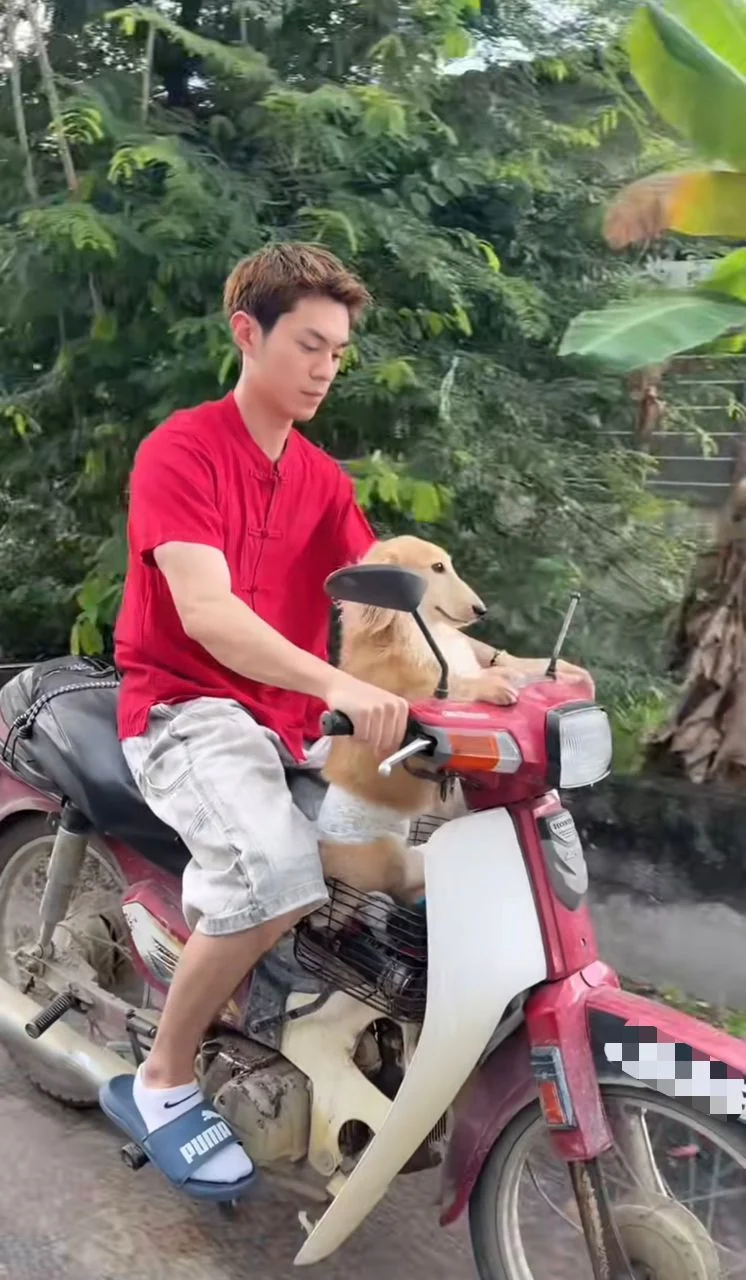 zhen with his pup yuji